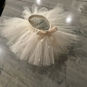 Dog tutu (ivory with pearls) new! My dog tried it on but it didn’t fit:(